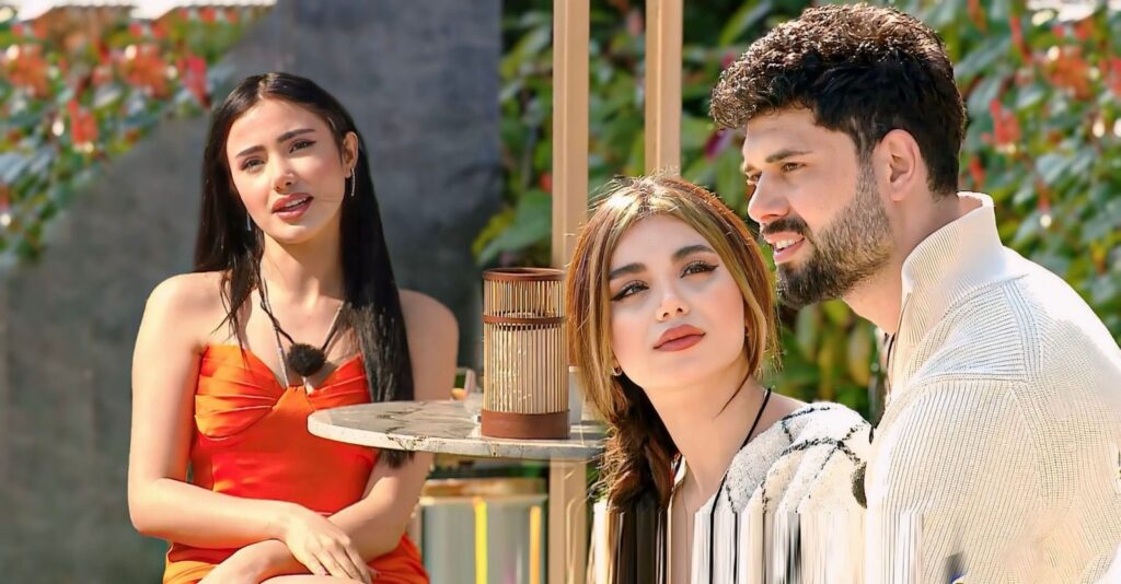 Three participants from the Arabic reality dating show Qesma W Naseeb sit outdoors in a sunny garden setting, engaged in conversation during a relationship-focused segment filmed exclusively for YouTube